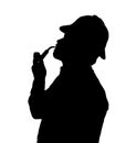 Silhouette of bearded man smoking pipe with Sherlock hat looking Royalty Free Stock Photo