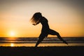 Silhouette of a happy dancer girl jumping the sunset Royalty Free Stock Photo