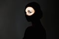 silhouette of beautiful girl in the dark. young woman with shadow on the face