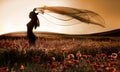 Silhouette of beautiful girl in the poppy field