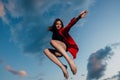 Attractive jumping woman dancer hovers in the sky Royalty Free Stock Photo