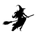 Silhouette of beautiful witch flies on broomstick Royalty Free Stock Photo