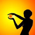 Silhouette of a beautiful woman holding the sun in her hands Royalty Free Stock Photo