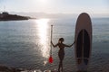 Silhouette of a beautiful woman on stand up paddle board. SUP, concept lifestyle, sport Royalty Free Stock Photo