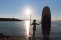 Silhouette of a beautiful woman on stand up paddle board. SUP, concept lifestyle, sport Royalty Free Stock Photo