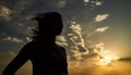 Woman with open arms standing at sunset seaside beach Royalty Free Stock Photo