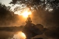 Silhouette of a beautiful Yoga woman in the morning Royalty Free Stock Photo