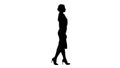 Silhouette Beautiful young business woman in formal wear walking.