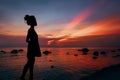 Silhouette of beautiful young woman on the beach at sunset Royalty Free Stock Photo