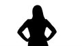 Silhouette Beautiful young woman walking with hands on hips and talking. Royalty Free Stock Photo