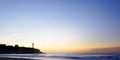 Silhouette of Biarritz lighthouse and houses. Sunset from the beach of the Chambre d`Amour. Royalty Free Stock Photo