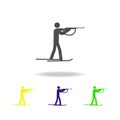 Silhouette biathlon athlete shooting athlete isolated multicolored icon. Winter sport games discipline. Symbol, signs can be used