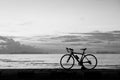 Silhouette bicycle on the beach sunset background,black and whit