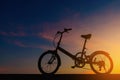 Silhouette bicycle on dramatic sky