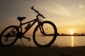 Silhouette bicycle with sunset or sunrise