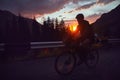 Silhouette of a bicyclist at sunset in the mountain