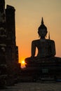 Silhouette of big buddha statue inside ruin temple at Sukhothai