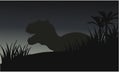 Silhouette of big tyranosaurus with grass Royalty Free Stock Photo