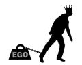 Silhouette big weight in the form of an ego is chained to the foot of a selfish and narcissistic man with a crown on his he Royalty Free Stock Photo