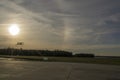 Silhouette of biplane about to land during sunset