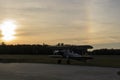 Silhouette of biplane about to take off during sunset Royalty Free Stock Photo