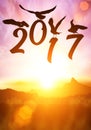 Silhouette of bird Holding Happy new year 2016 text