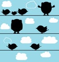 Silhouette of birds owl on a wire with clouds Royalty Free Stock Photo
