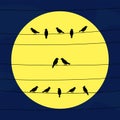 Silhouette of birds on wires in full moon light Royalty Free Stock Photo