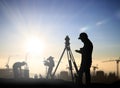 Silhouette black man survey and civil engineer stand on ground w Royalty Free Stock Photo