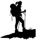 Silhouette of a woman hiking