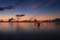 Silhouette of boat against the sunrise sky