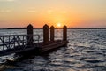 Silhouette Of A Boat Dock At Sunset
