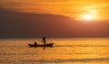 Silhouette of boat and fisherman sunset time