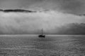 Silhouette Boat In Fog. Black and white image. Royalty Free Stock Photo