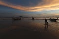 Silhouette of boat and people against the sunset sky Royalty Free Stock Photo