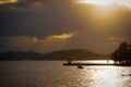 Silhouette boat in sea against sky during sunset Royalty Free Stock Photo