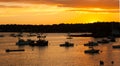 Silhouettes of boats at sunset