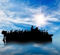 Silhouette of boats with refugees