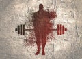 Silhouette of bodybuilder and barbell from particles.