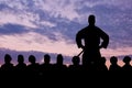 Silhouette of a border guard and detained refugees