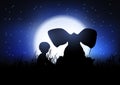 Silhouette of a boy and an elephant silhouetted against night sky