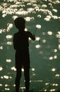 Silhouette of boy fishing Royalty Free Stock Photo