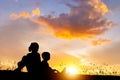 Silhouette of boy and girl with guitar having fun outdoor, Portrait of adorable brother and sister playing outdoors. Asian kids Royalty Free Stock Photo