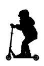 Silhouette of a boy with his scooter