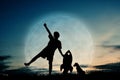 Silhouette boy holding a rocket paper and playing with little dog Royalty Free Stock Photo