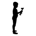 Silhouette boy holds toy child hold giraffe preschool brother holding amigurumi son with gifts teddy plaything presents friend