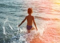 Silhouette of boy jumping in sea Royalty Free Stock Photo
