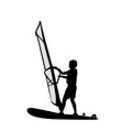 Silhouette boy learning to windsurf. Windsurfing water sport