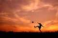 Silhouette a boy playing football Royalty Free Stock Photo