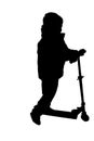 Silhouette of a boy riding scooter Royalty Free Stock Photo